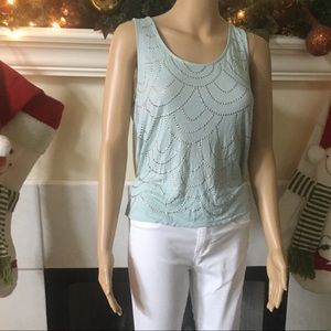 Light blue sleeveless top with gold studs
